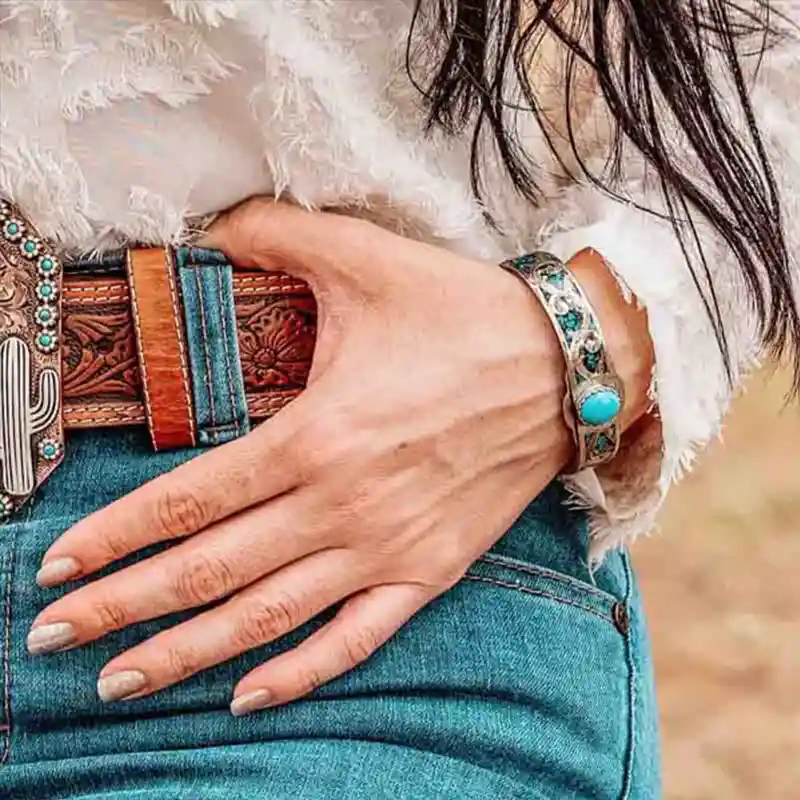 Woman cuff bracelet with turquoise stones and silver base